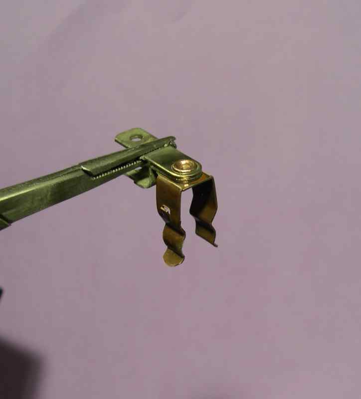 Shiny clip around rivet