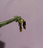 Shiny clip around rivet