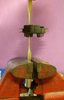 Setting rivets in assembled fusebox